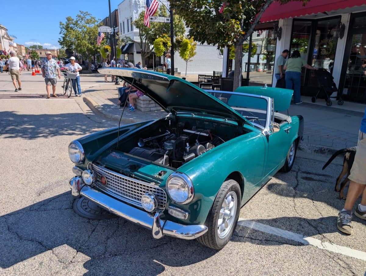 Turquoise 1950s convertible with hood open