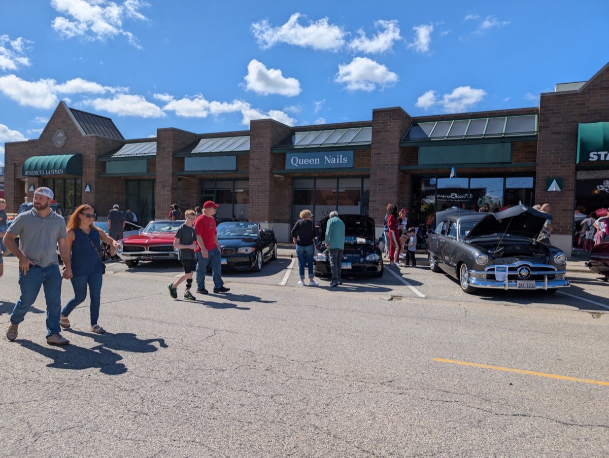 Vintage cars in front of historic Queen Sadie building