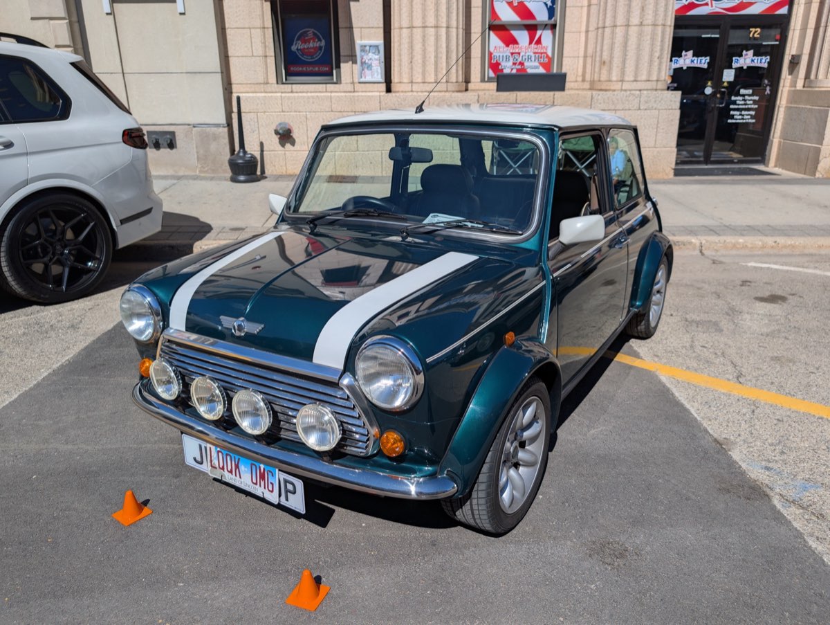 Green Mini Cooper with racing stripes